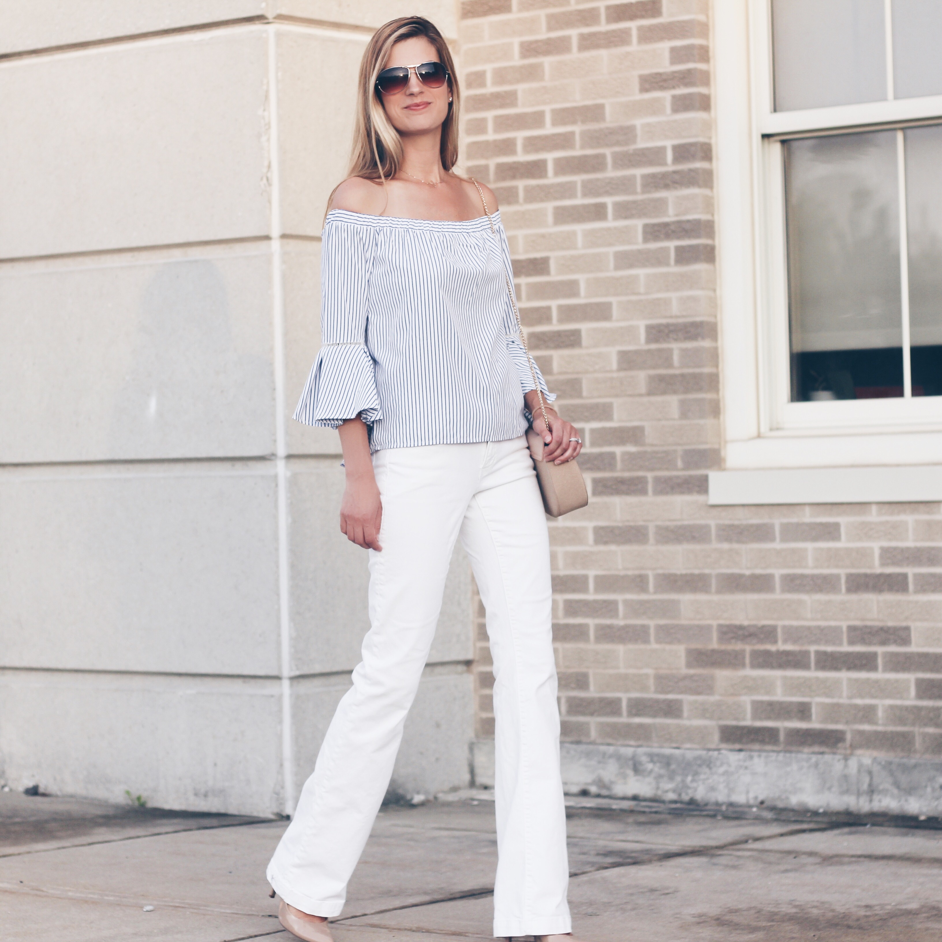 striped off the shoulder top with bell sleeves paired with white wide leg denim