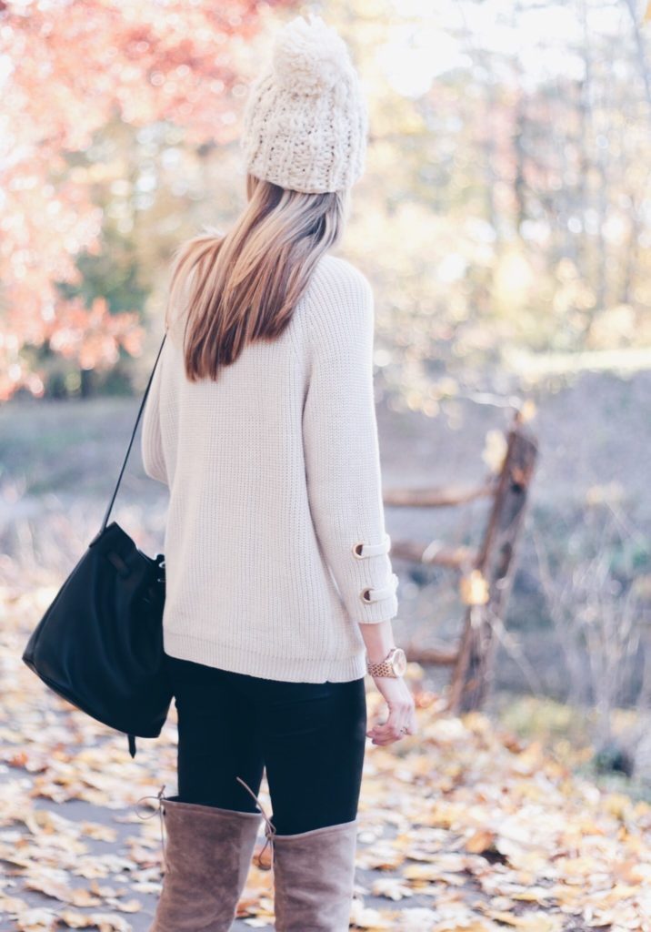 Connecticut life and style blogger, Pinteresting Plans shares a holiday out complete with lace-up sweater, fur vest, and over the knee boots.